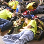 photo by Randy James of exhausted future firefighters taking a break at the Junior Firefighters Camp in Jackson's Mill WV.